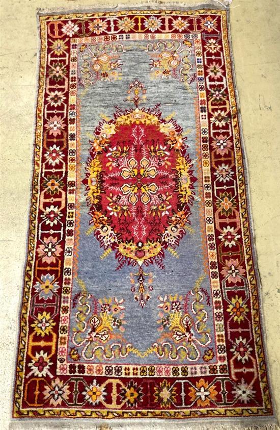 A Turkish rug, 184 x 92cm
